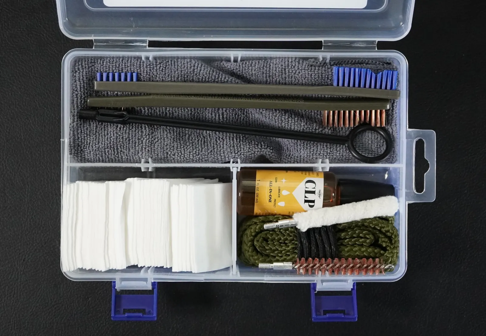 RangeReady 9mm Handgun Cleaning Kit contents laid out: bore snake, one-piece rod, brushes, CLP, patches, and microfiber cloth in a compartment case